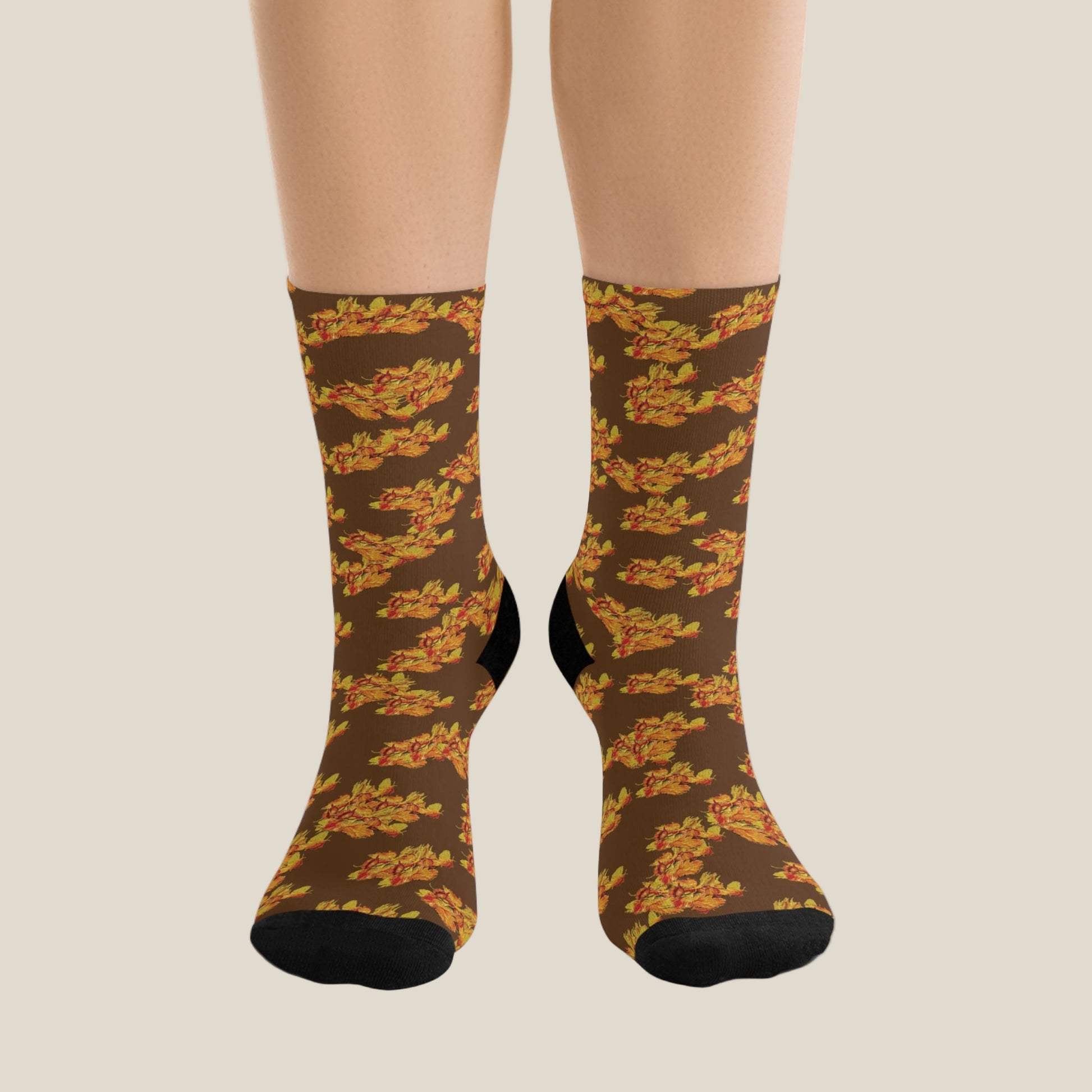 Brown socks with leaf pattern worn by a person